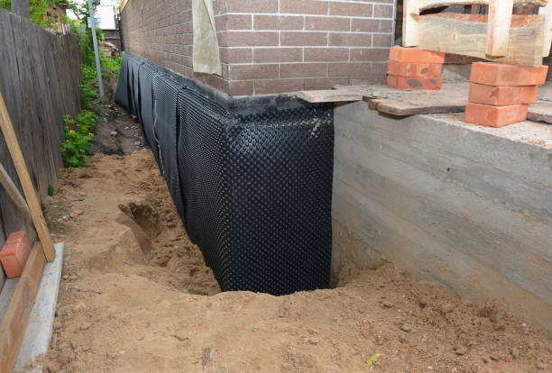 SJ Waterproofing Pros technician performing targeted Waterproofing assessment in Buhl, MN